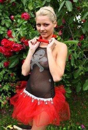 Cute blonde teen Buffy hikes up a tutu before masturbating in the back yard on fansgirls.net