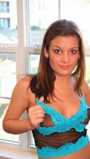 Young amateur Kate Crush places her hand over her exposed breasts on fansgirls.net