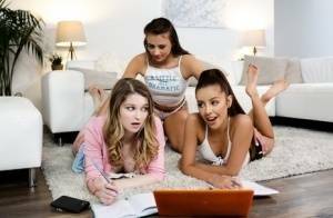 Young girls get busy with a lesbian threesome on a sofa ensemble on fansgirls.net