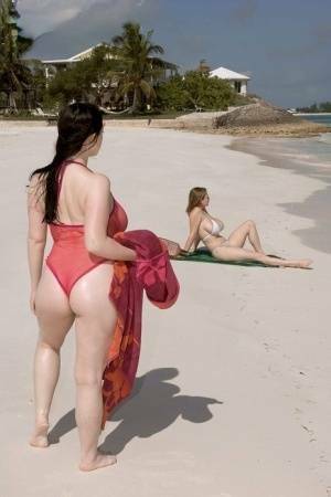 Plump female Christy Mark and her big boobed friend have lesbian sex on beach on fansgirls.net