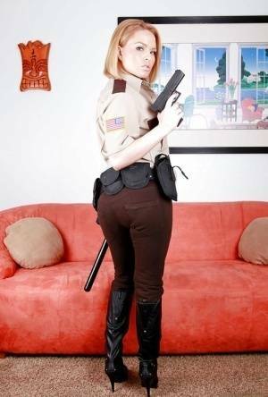 Hot babe in police uniform Krissy Lynn stripping and spreading her legs on fansgirls.net