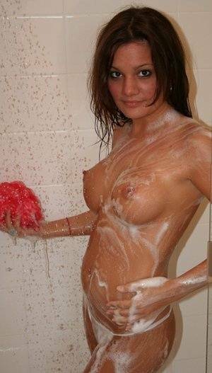 Teen amateur Kate Crush soaps her perky breasts while taking a shower on fansgirls.net