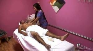 Asian brunette Morgan Lee dose handjob to a guy while massaging him on fansgirls.net