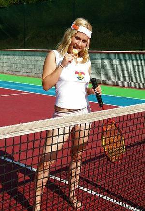 Sporty babe with big tits Angel B toying her cunt on the tennis court on fansgirls.net