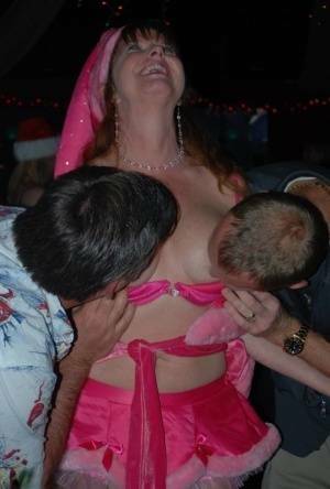 Mature lady Dee Delmar and friends hit the swing club for Christmas orgy on fansgirls.net
