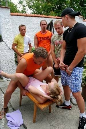 Clothed Euro slut takes on five men during a gangbang on patio on fansgirls.net