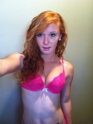 Natural redhead Alex Tanner slips off her pink lingerie set for nude selfies on fansgirls.net