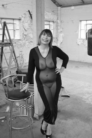 Middle-aged woman Barby Slut models a see-thru dress for a black-and-white gig on fansgirls.net