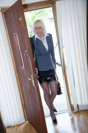 Older MILF Jan Burton strips off business clothes after a hard day at office on fansgirls.net
