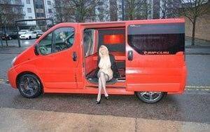 Mature blonde Barby Slut exposes herself inside a camper while in the city on fansgirls.net