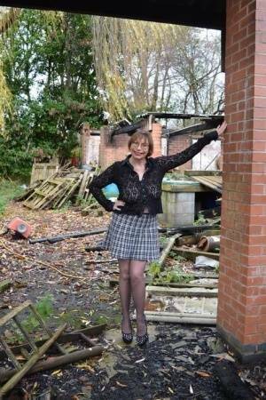 Amateur chick Barby Slut strips to her heels on a demolition site on fansgirls.net