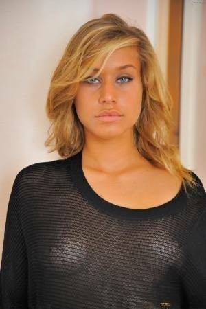 Sensual blonde lady simply loves spreading her cute buttcheeks on fansgirls.net