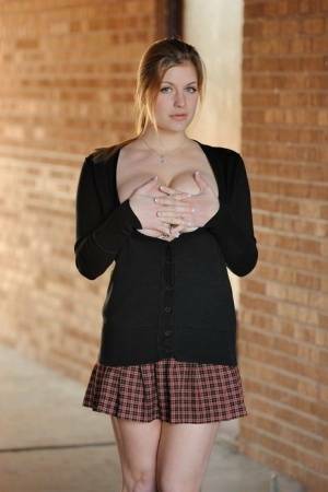 Amateur abbe letting big natural schoolgirl tits loose outdoors in socks on fansgirls.net