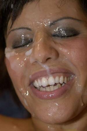 Latina slut Scarlett March gets her face covered in sperm during a gangbang on fansgirls.net