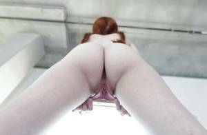 Young redhead Dolly Little revealing shaved pussy in pigtails and socks on fansgirls.net