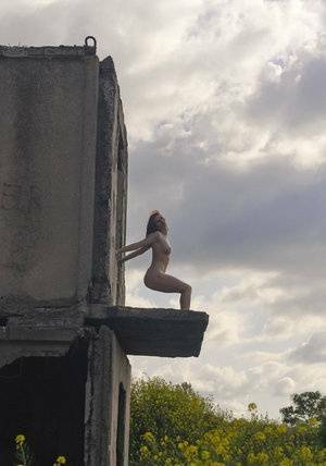 Natural redhead Elis B poses for a daring nude shoot in an derelict building on fansgirls.net