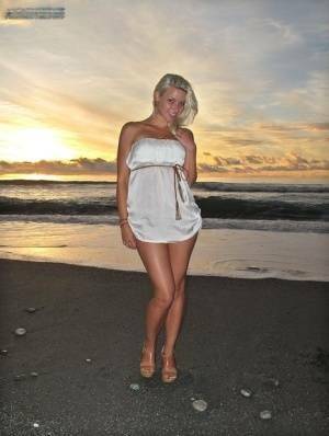 Hot blonde Anikka Albrite strips naked at the beach before nude hitchhiking on fansgirls.net