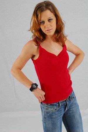 Natural redhead Sabine shows off her black G-shock watch while fully clothed on fansgirls.net