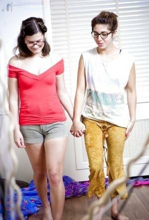 Glasses wearing lesbians Sabina M and Tallulah dress hairy twats on fansgirls.net