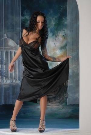 Leggy Latina chick Angelina Valentine removes a long black dress to pose nude on fansgirls.net