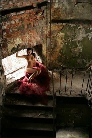 Slim brunette with a great ass models totally naked in deserted building on fansgirls.net