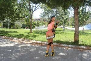 Latina solo girl Carolina Abril shedding shorts to expose nice ass outdoors on fansgirls.net