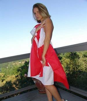 Canadian teen Karen wraps her naked body in a flag on her back deck on fansgirls.net