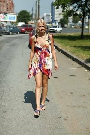 Charming teen blonde posing solo in a lovesome dress outdoor on fansgirls.net