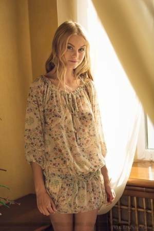 Cute blonde teen Nancy A slips off her floral dress to model naked on fansgirls.net