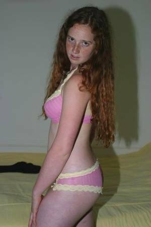 Flexible redhead Rachel showcases her natural pussy after lingerie removal on fansgirls.net
