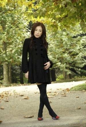Fully clothed Japanese teen models in the park in black clothes and stockings - Japan on fansgirls.net