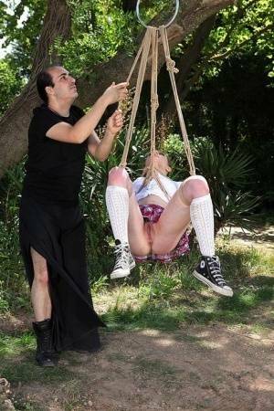 Schoolgirl Samantha Bentley finds herself suspended from ropes in the woods on fansgirls.net