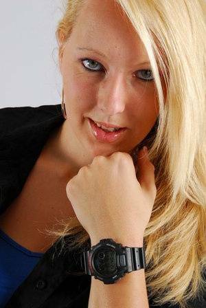 Blue-eyed blonde Britt displays her black G-Shock during non-nude action on fansgirls.net