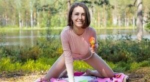 Young amateur Ava bares her hard body on a blanket near the water on fansgirls.net