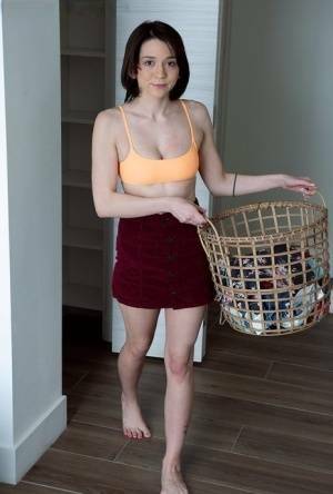 Young brunette Riley Jean makes her nude debut on a bed during laundry day on fansgirls.net