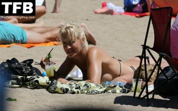 Sarah Connor Flashes Her Nude Breasts on the Beach on fansgirls.net