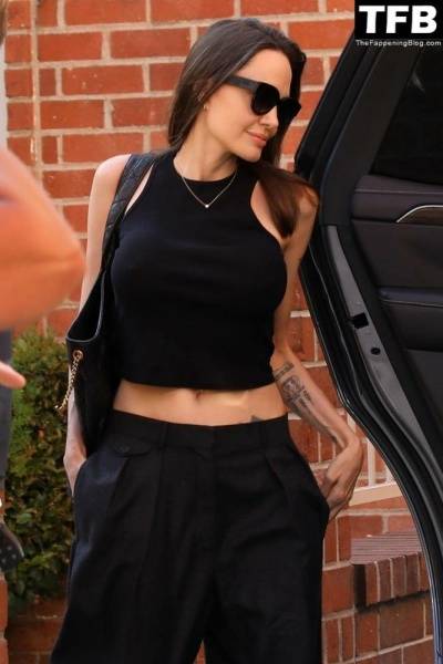 Angelina Jolie Shows Off Her Tight Tummy Leaving an Office Building on fansgirls.net