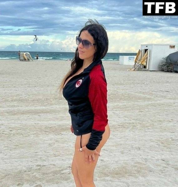 Claudia Romani Supports AC Milan While Tanning on Miami Beach on fansgirls.net
